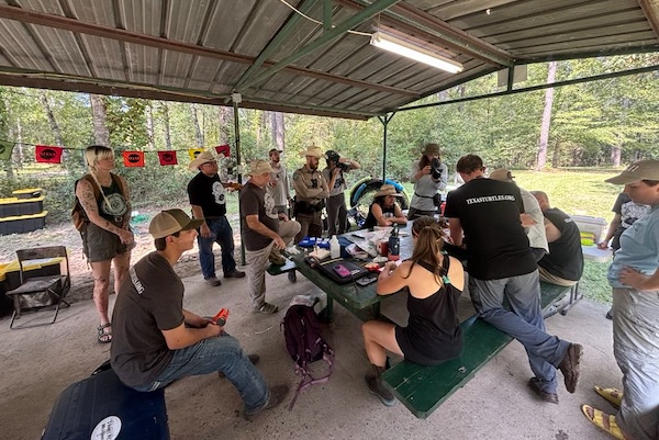 Participants around a data collection table at "Snapperpalooza" in 2024.